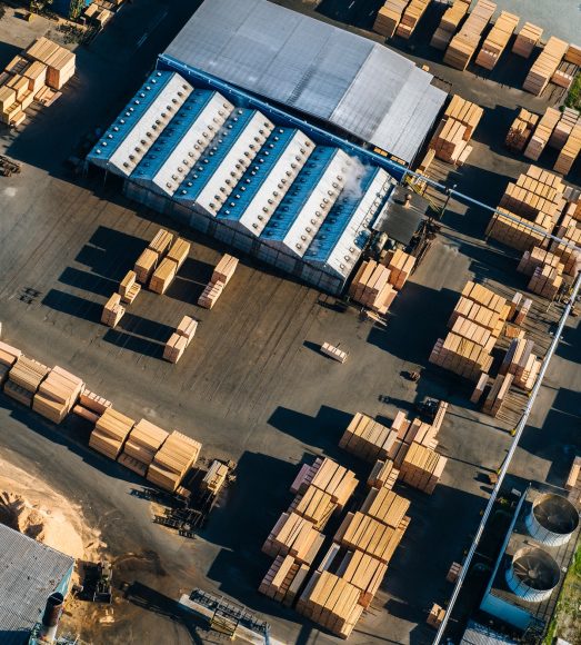 Aerial view of stacked planks in timber yard