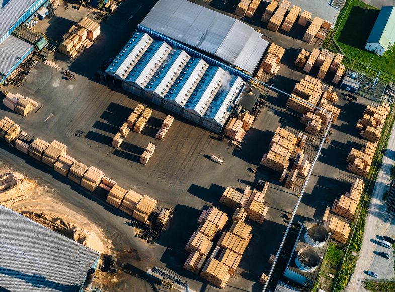 Aerial view of stacked planks in timber yard