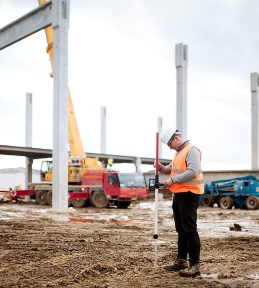 industrial civil engineer working with prefabricated cement pillars