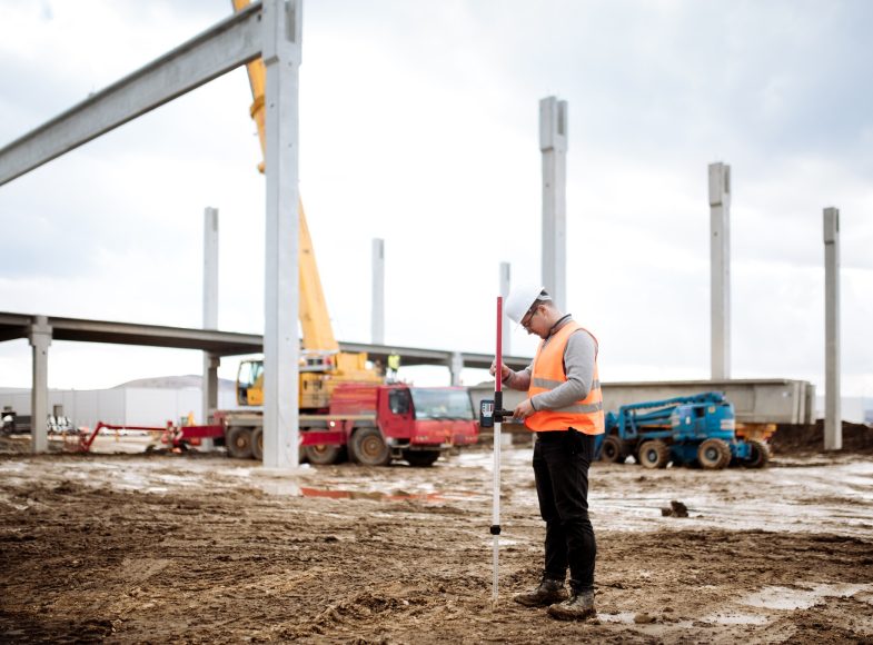 industrial civil engineer working with prefabricated cement pillars